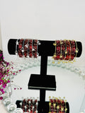 Red glass bangles with silver & gold ghungroo bangles